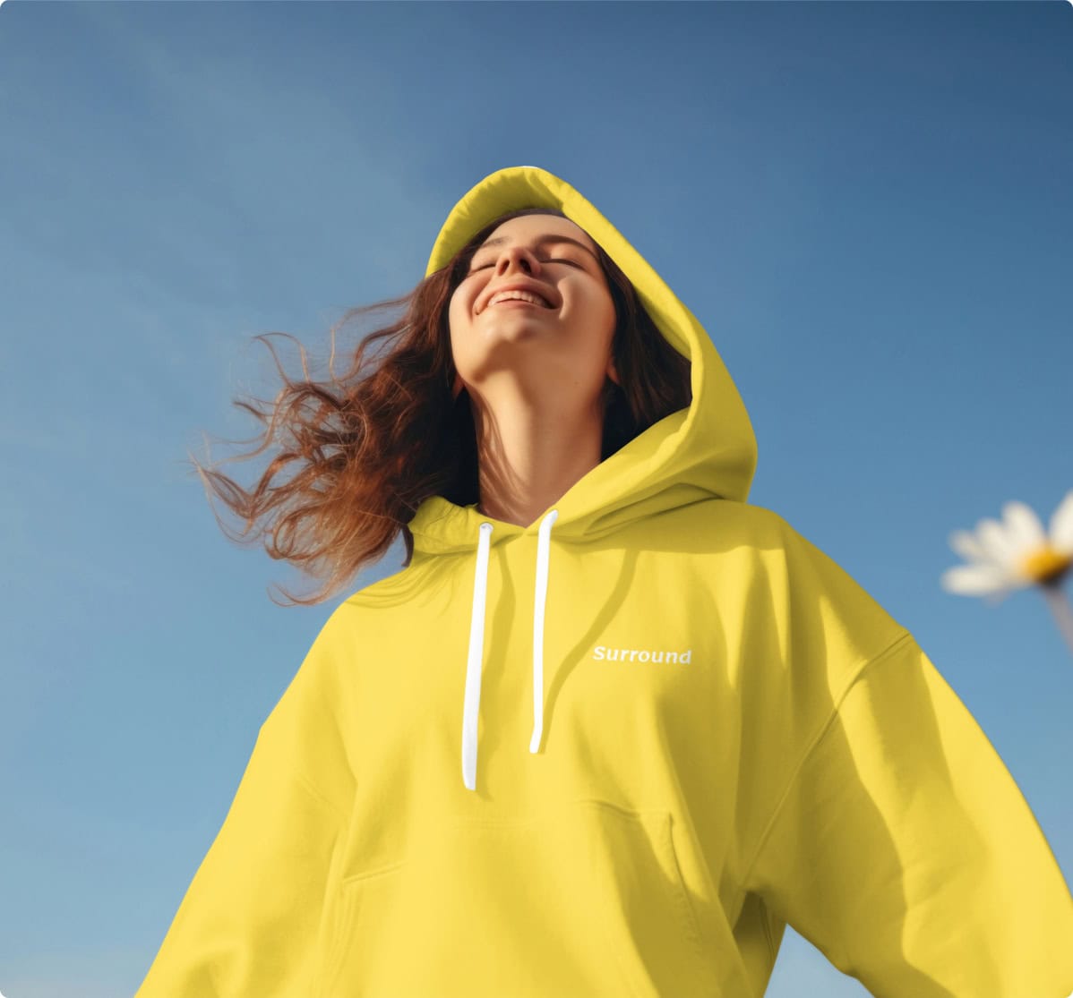 Girl enjoying a sunny day in a yellow hoodie